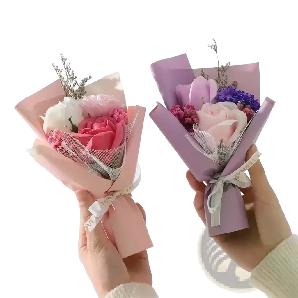 Artificial rose flower bouquet with pink and lavender soap flowers wrapped in matching paper with delicate mesh accents