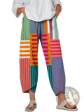 Artistic printed and embroidered slimming cropped pants featuring colorful patchwork wide-leg vertical stripes in green orange pink and blue