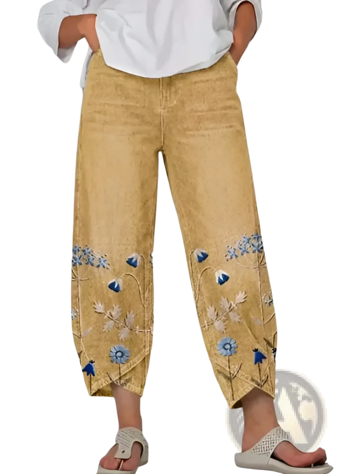 Artistic printed and embroidered slimming cropped tan denim pants with blue and pink floral embroidery on lower legs