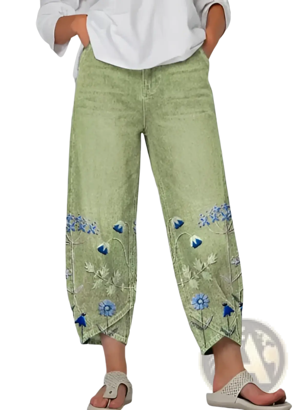 Light green corduroy slimming cropped pants with blue and white floral embroidery along the lower legs