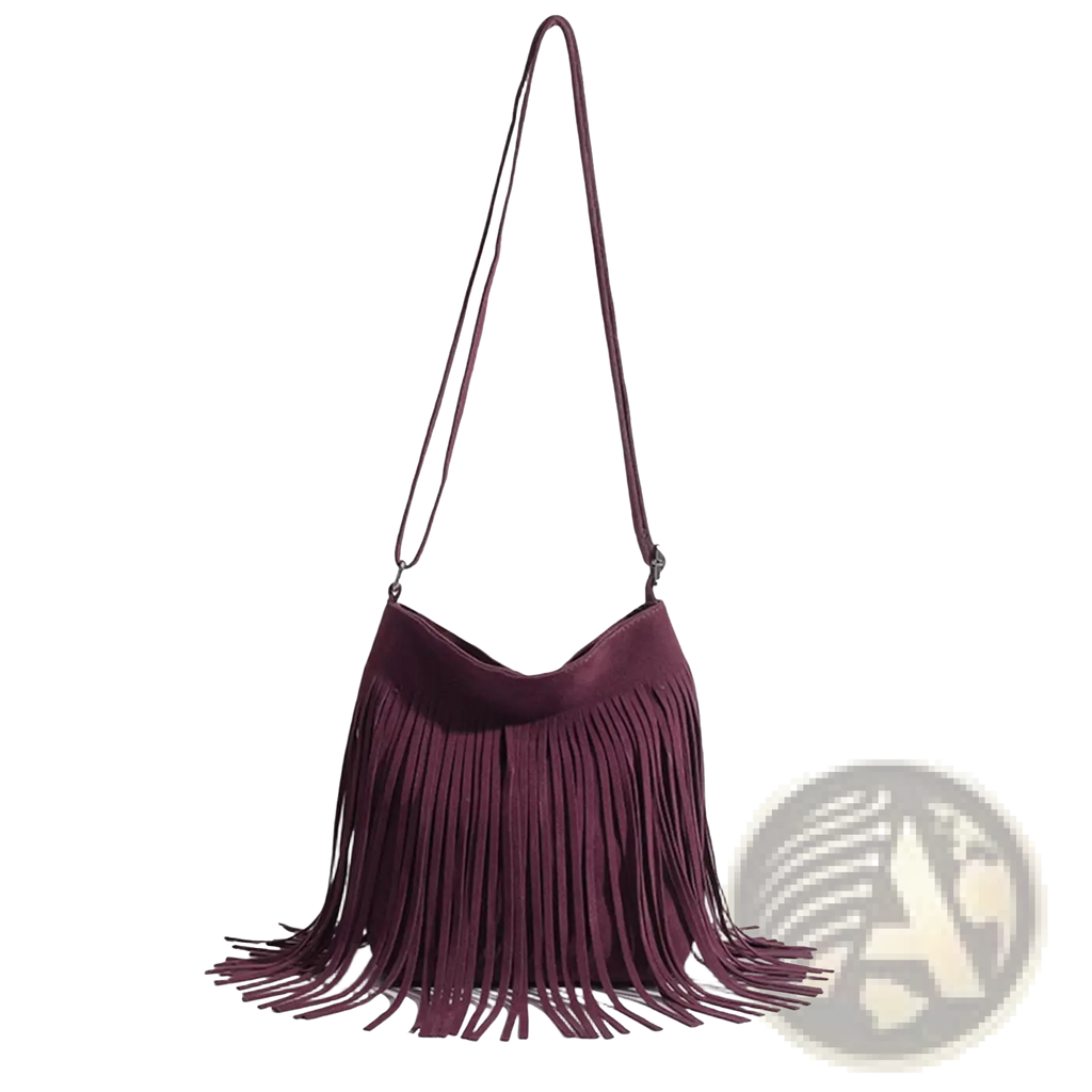 A maroon suede fringe shoulder bag with a long strap designed for travel and artistic tassel detail
