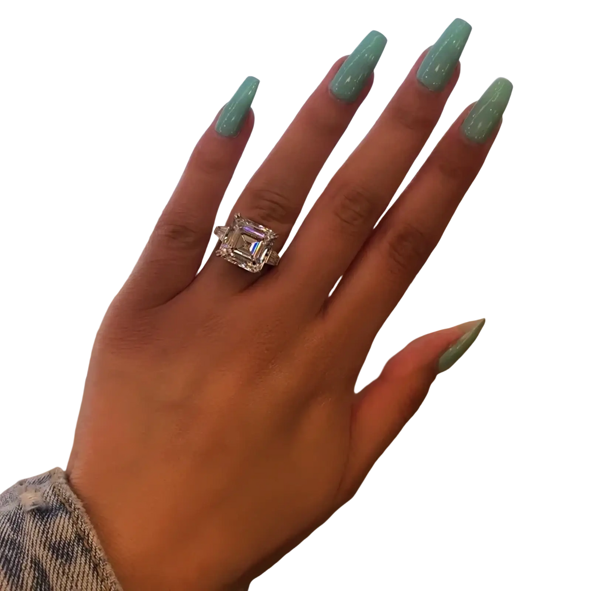 Asscher cut lab diamond sterling silver promise ring with a sparkling emerald-cut diamond on a finger with mint green nails