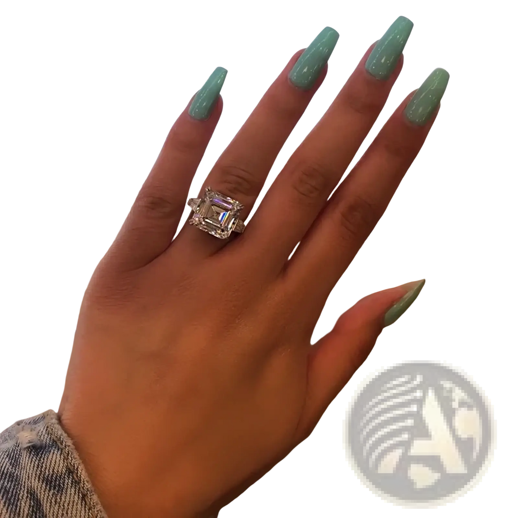 Asscher cut lab diamond sterling silver promise ring with a sparkling emerald-cut diamond on a finger with mint green nails