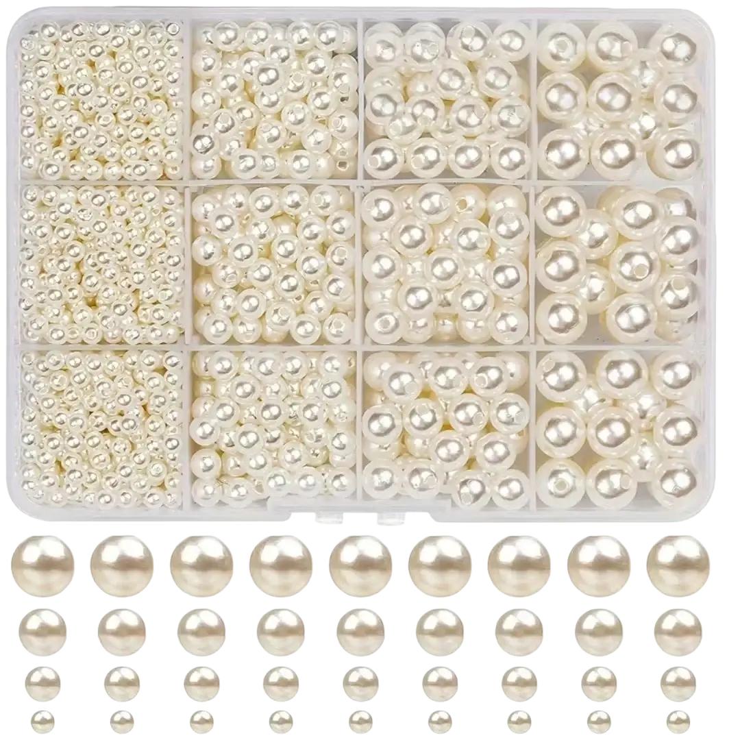 A clear plastic organizer box filled with assorted cream-colored pearl round beads for diy jewelry making arranged below