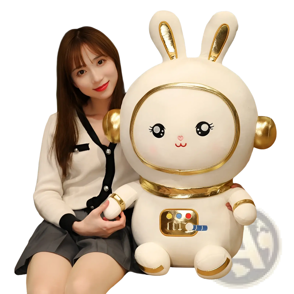 White plush astronaut bunny stuffed toy with gold accents and colorful control panel on its chest