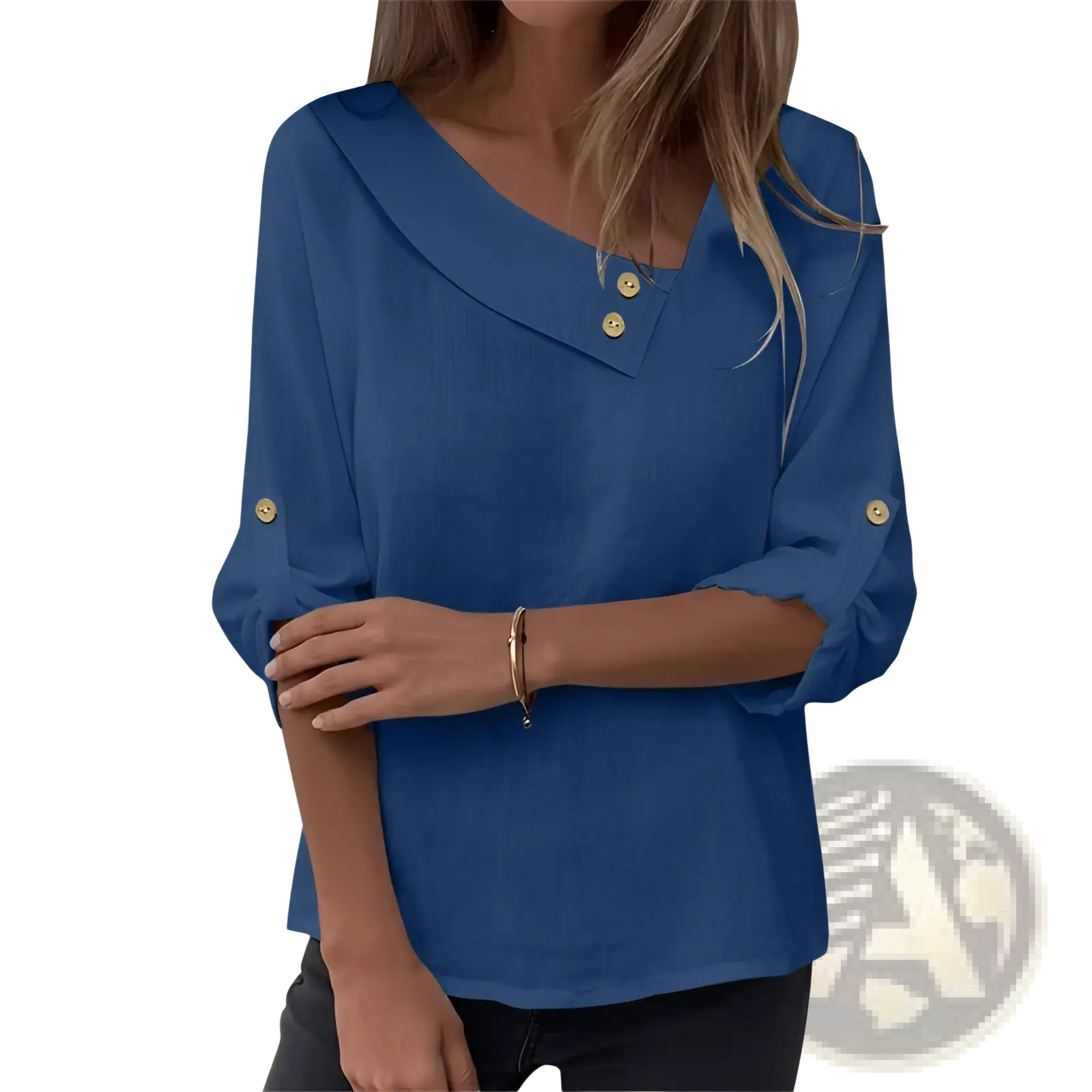 A blue long-sleeved asymmetric button blouse with v-neckline and gold buttons at collar and cuffs