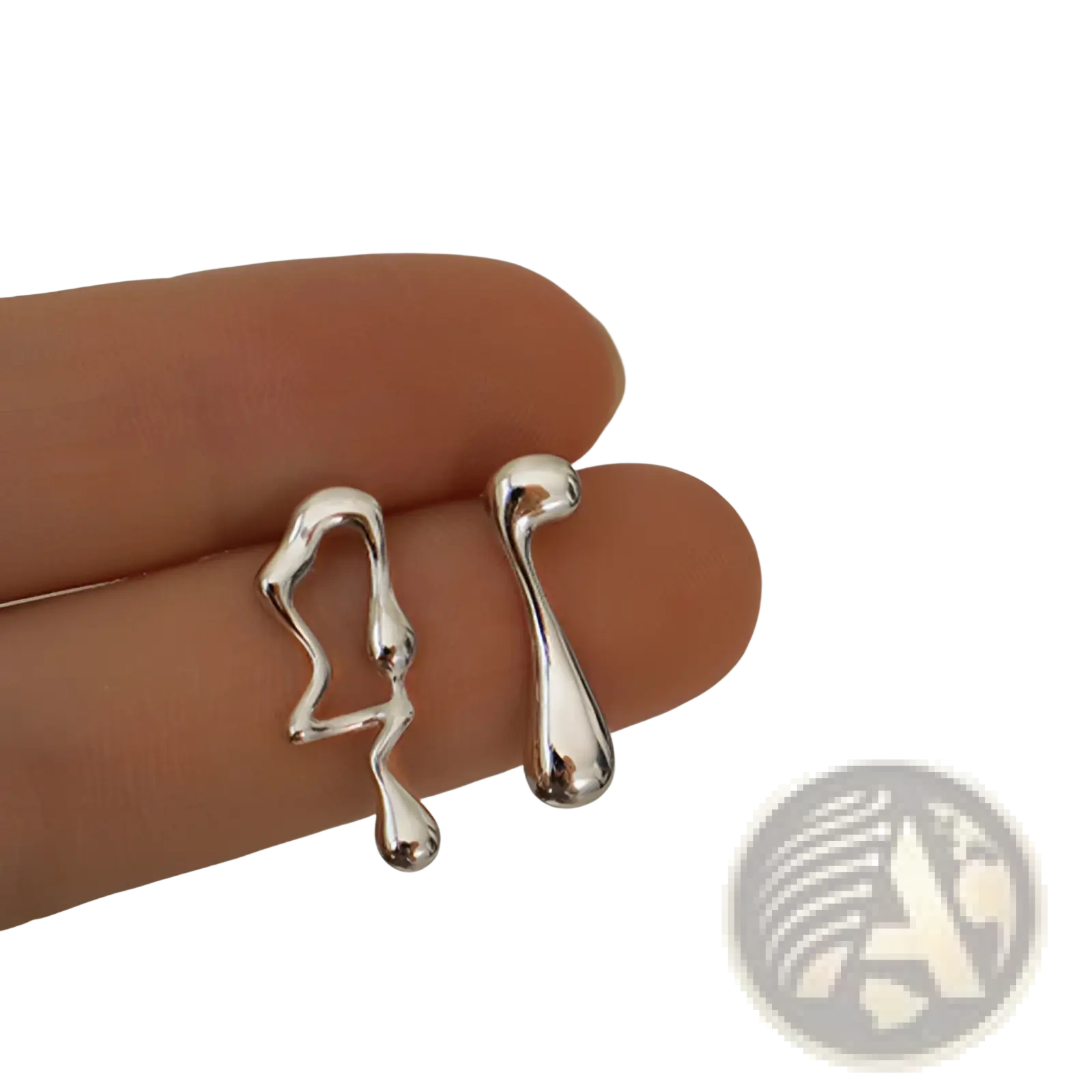 Asymmetric liquid silver lava stud earrings featuring abstract smooth liquid-like silver ear clips