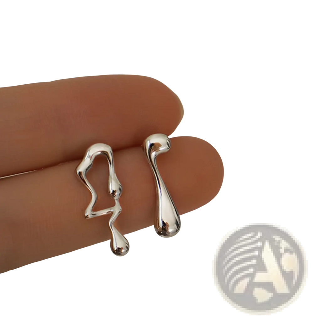 Asymmetric liquid silver lava stud earrings featuring smooth abstract ear clips with a polished, liquid-like design