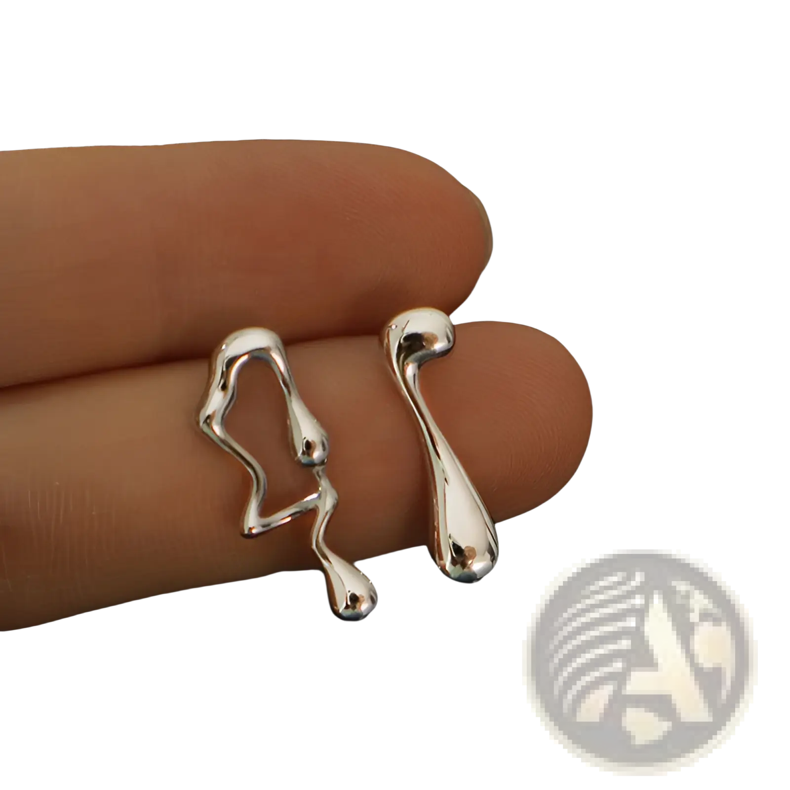 Asymmetric liquid silver lava stud earrings featuring silver abstract shapes with a liquid-metallic finish and flowing contours