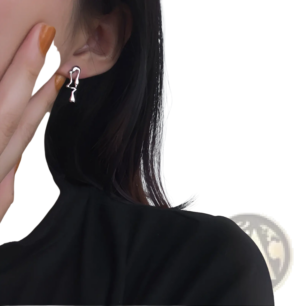 Silver asymmetric liquid lava stud earring with a minimalist flowing abstract silhouette design