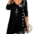 Black asymmetrical knit tunic dress with plaid patchwork panel and decorative buttons down the front