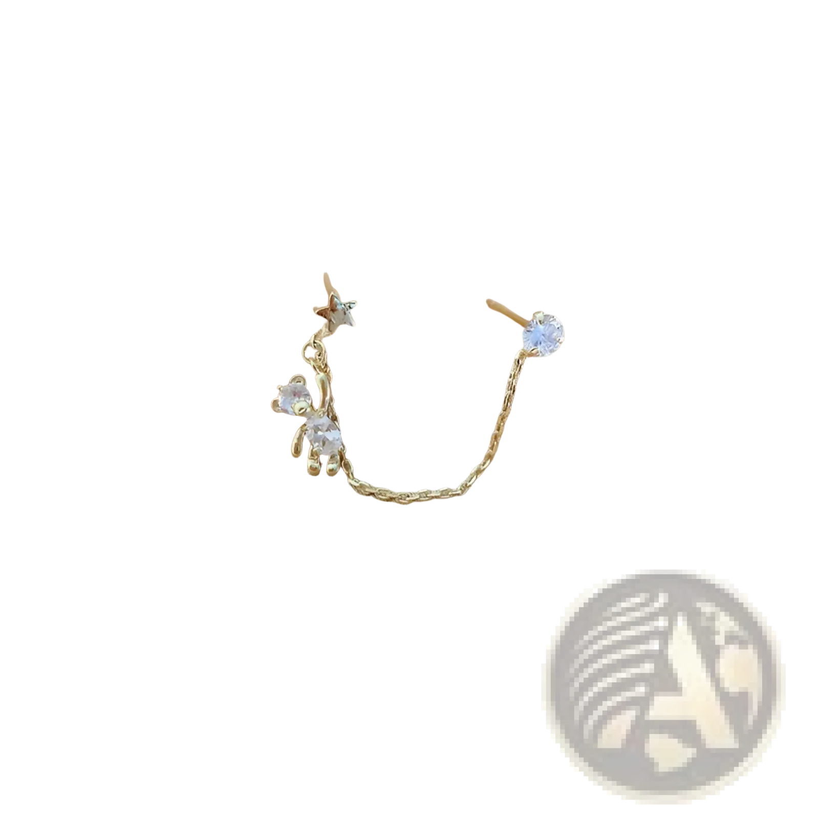 Gold-toned asymmetrical rhinestone bear and star tassel ear cuff featuring a tiny bear charm and clear crystals connected by a chain