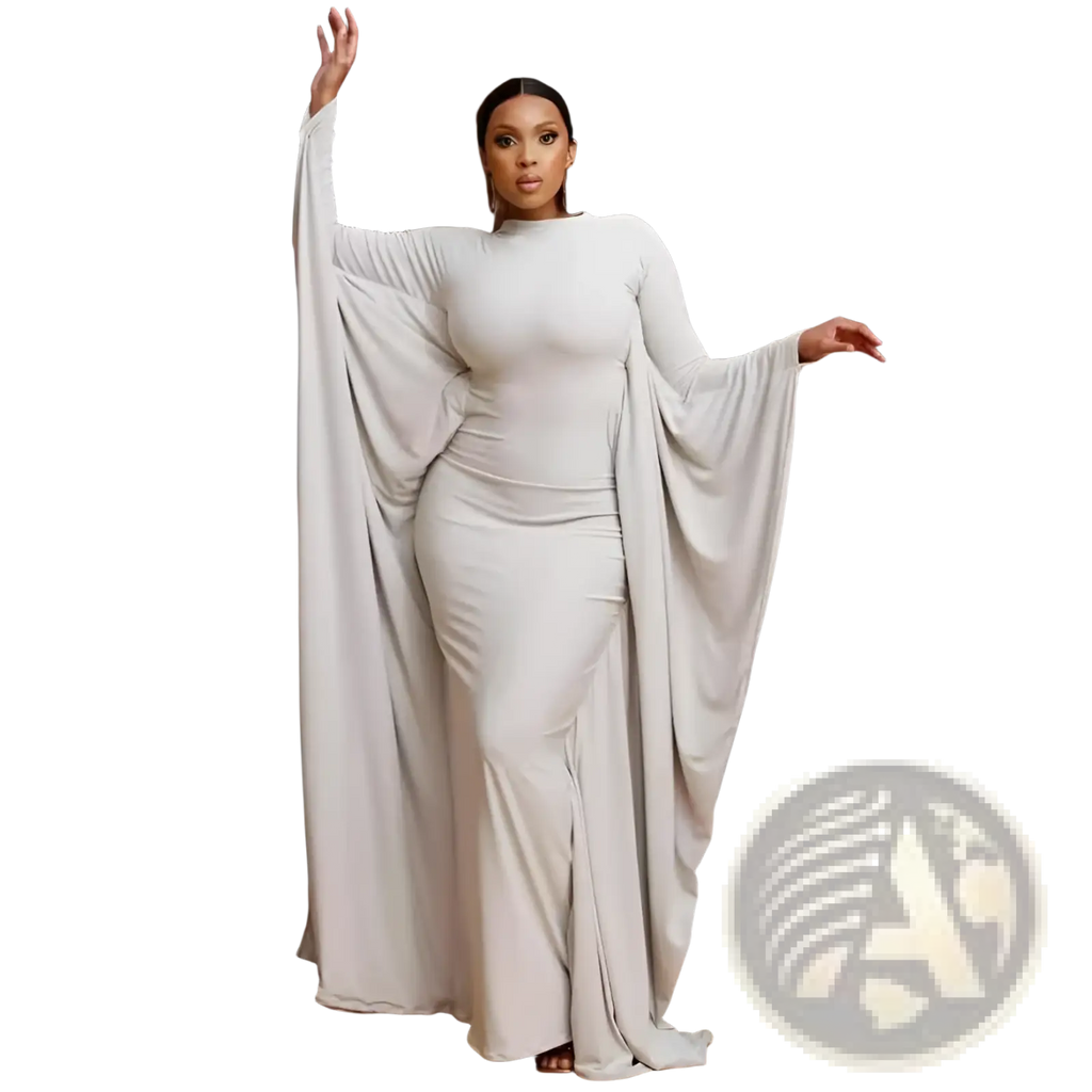 An off-white asymmetrical satin maxi dress with batwing sleeves and a high neckline