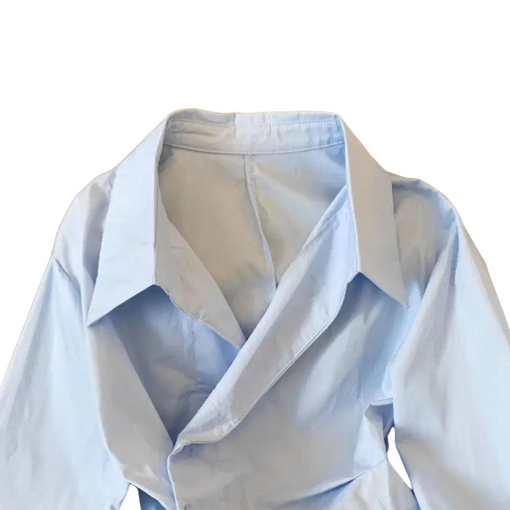 A light blue asymmetrical v-neck formal blouse with long sleeves and a crisp collar featuring subtle creases