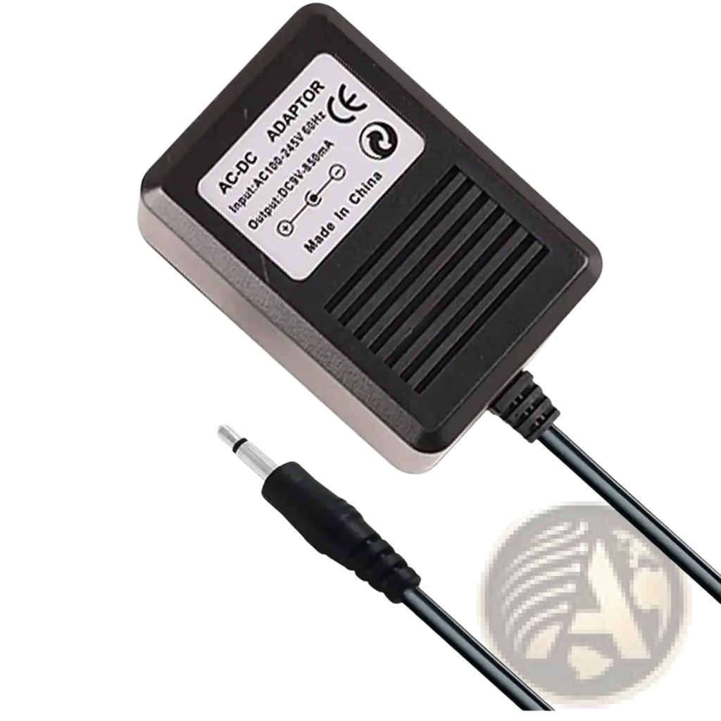 Black plastic atari 2600 replacement power supply with 3.5mm audio jack coiled cable made in china label visible