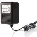 Black plastic Atari 2600 replacement ac-dc power supply with coiled black and white cable for US plug use