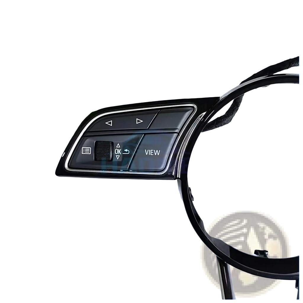 Audi A4 B9 A3 8y black glossy plastic steering wheel control module with silver trim and labeled media volume buttons