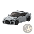 Gray lego-built Audi RS7 sports car model toy with black wheels and transparent windows shown from the back side