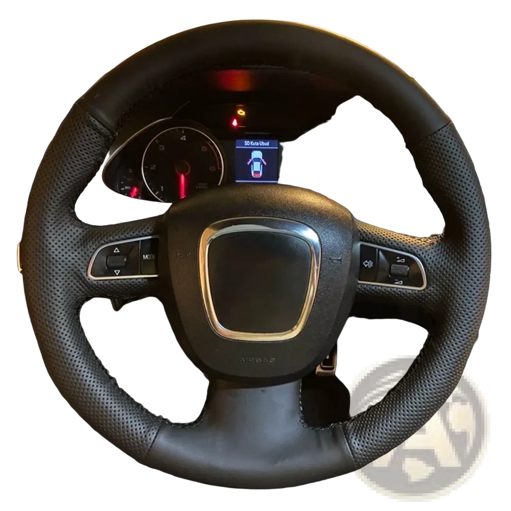 Black perforated leather Audi steering wheel cover with red stitching silver accent center and integrated control buttons