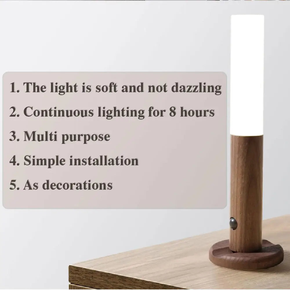 A sleek minimalist magnetic wooden motion sensor led night light with a warm wooden base and white cylindrical diffuser
