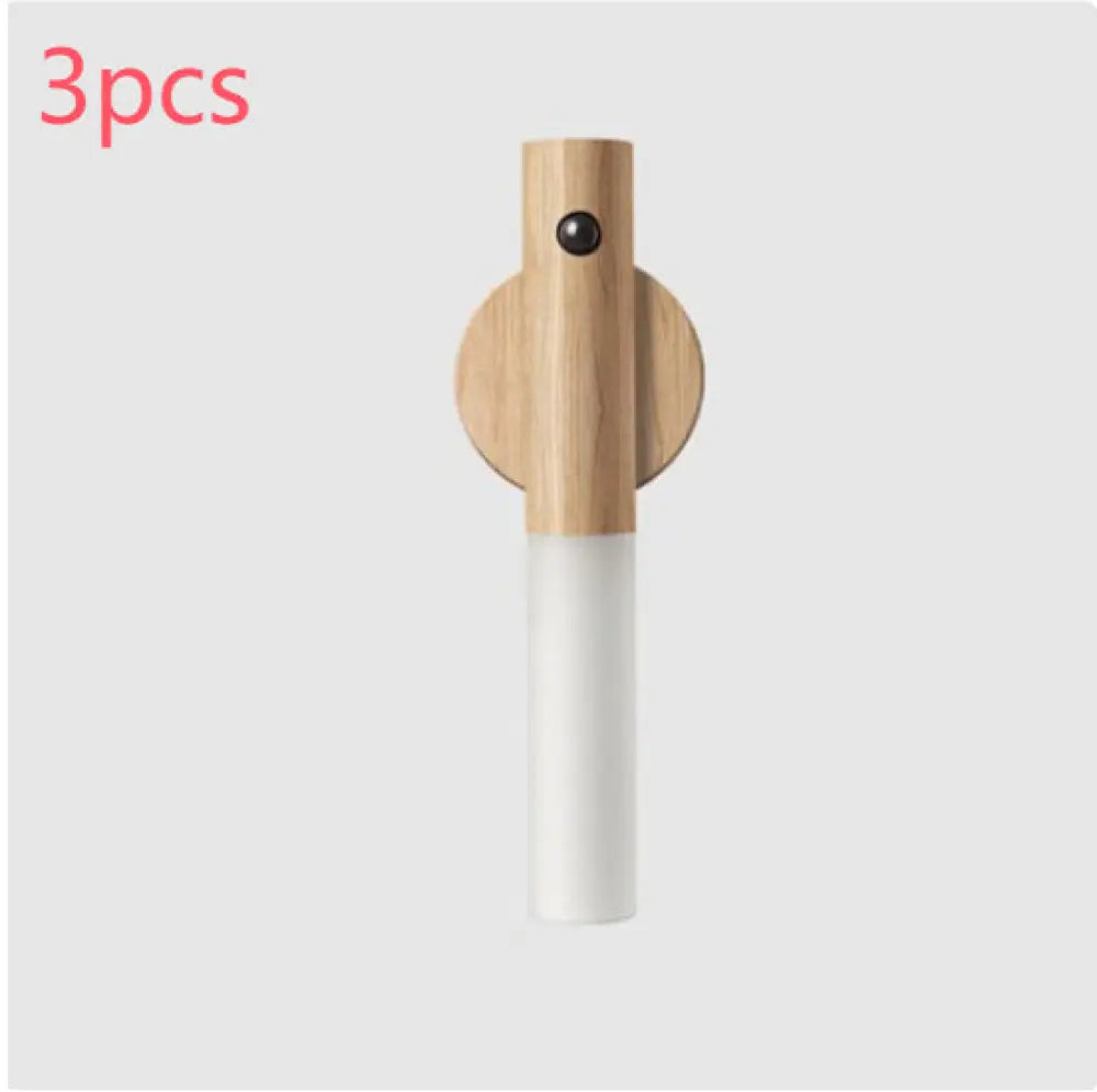 Minimalist magnetic wooden motion sensor LED night light with matte white cylindrical wall-mounted lampshade