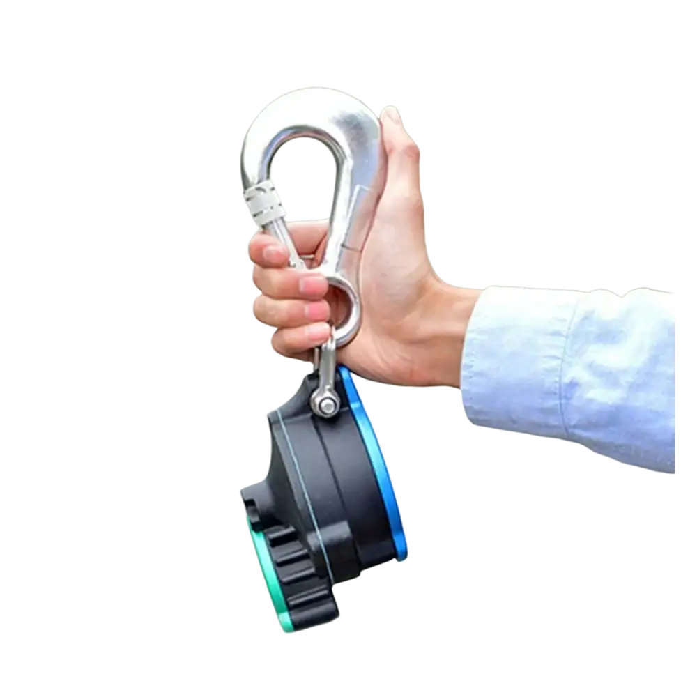 A sleek black and blue auto rope descender emergency escape device with green accent attached to a silver carabiner