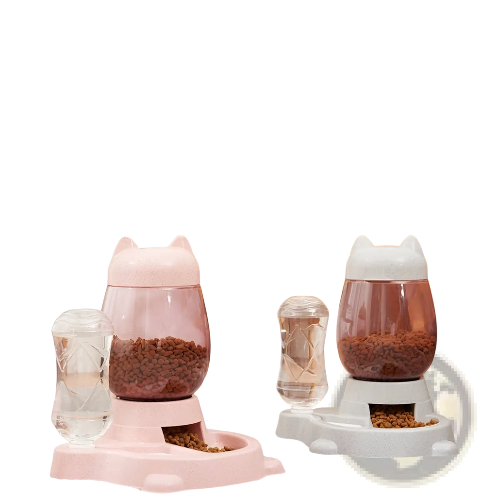 Pink and white cat-shaped automatic pet feeders with transparent bowls filled with kibble for feeding cats