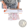 Automatic food vacuum sealer machine white and orange sealing clear plastic bag with two whole fish with 10 bags included