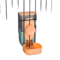 Pastel-colored automatic pet feeder made of high-quality plastic with clear food storage reservoir and peach lid mounted on cage bars