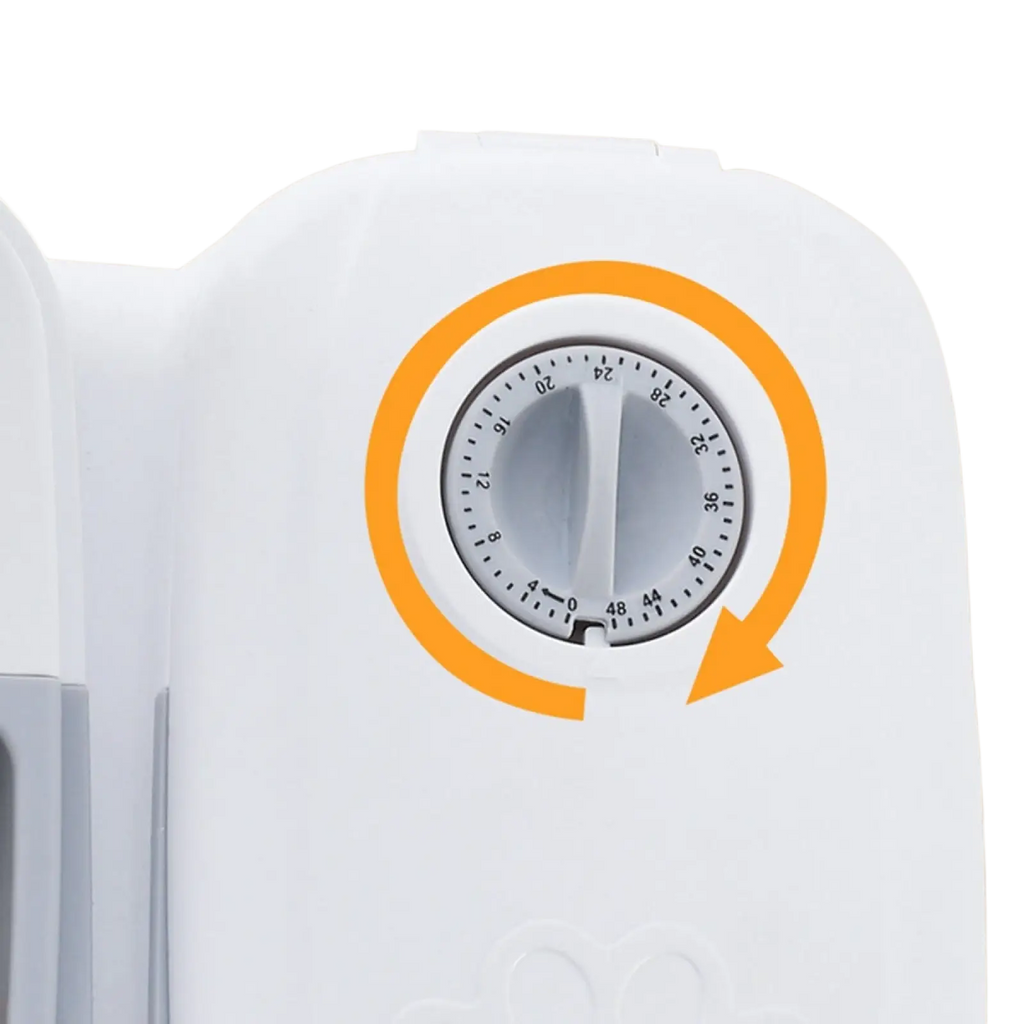 White plastic buckle cover with 24-hour dial and orange rotation arrow on automatic pet feeder gravity waterer