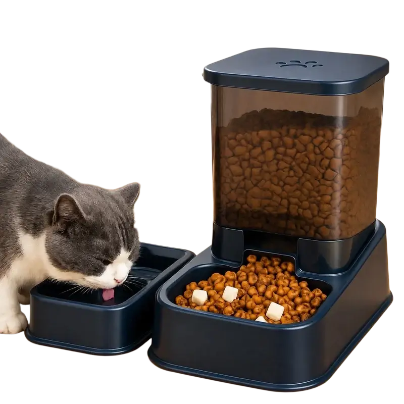 Automatic pet feeder in dark blue plastic with transparent top compartment dispensing kibble into base bowl