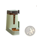 Mint green automatic pet feeder with transparent compartment containing brown kibble for feeding pets