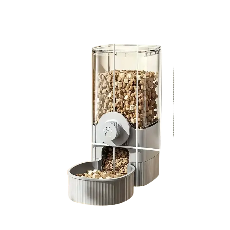 Gray automatic pet feeder with transparent upper compartment and ribbed bowl featuring paw-print dispensing knob