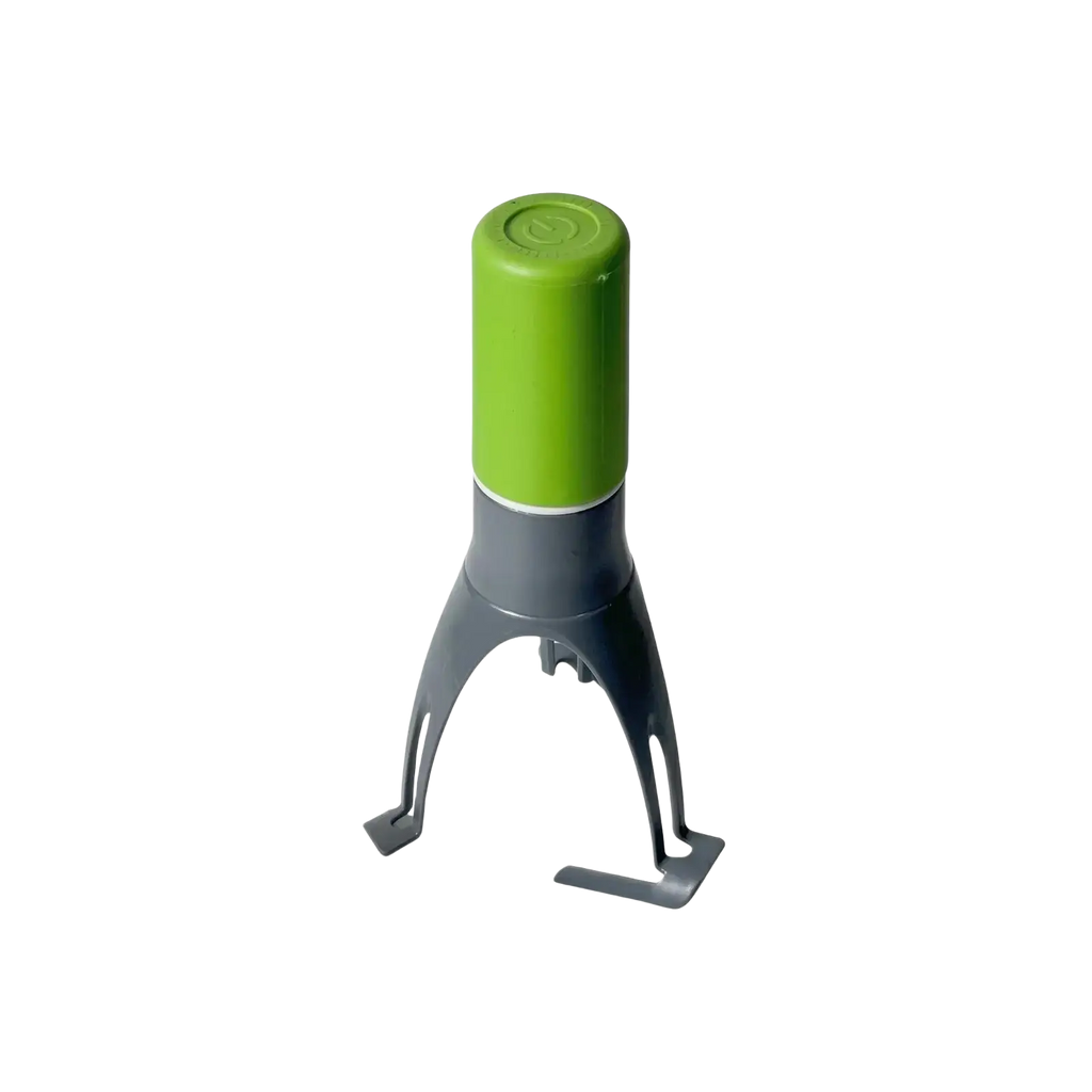 Green and gray silicone automatic stirrer for pots and pans with a cylindrical top and three-leg pan stirrer base
