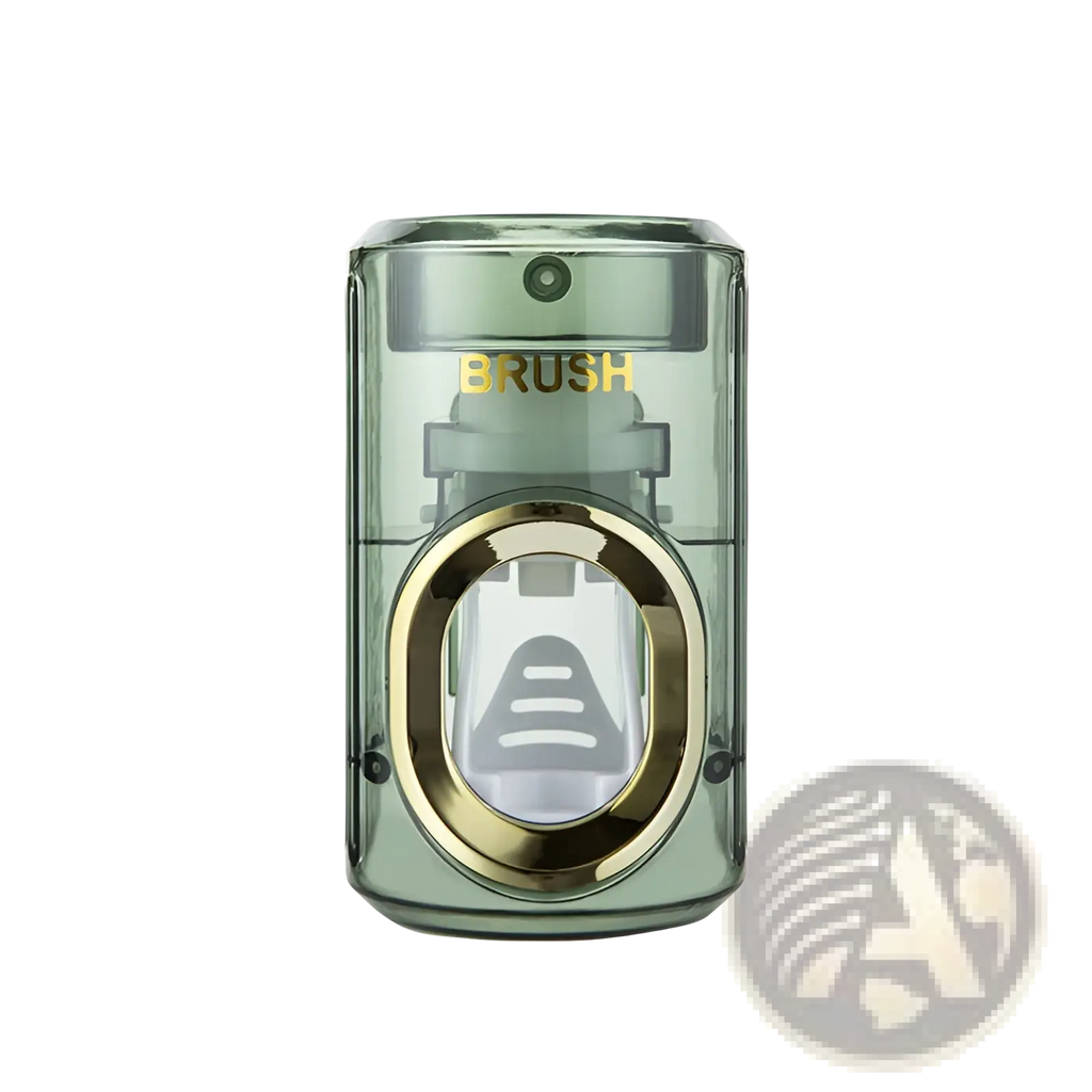 Transparent green plastic automatic toothpaste dispenser and toothbrush holder with gold metallic trim and visible brush compartment