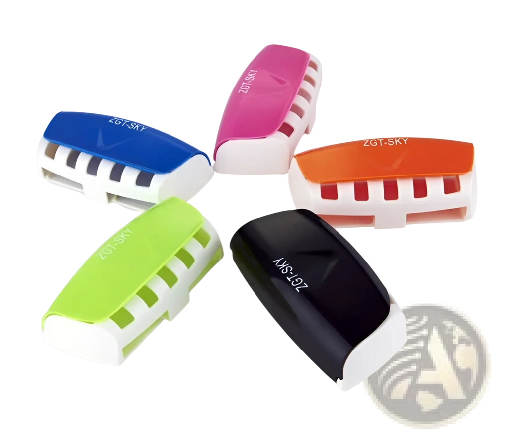Colorful plastic automatic toothpaste dispenser and toothbrush holder set with sleek modern design and white base