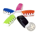 Colorful plastic automatic toothpaste dispenser and toothbrush holder set with sleek modern design and white base