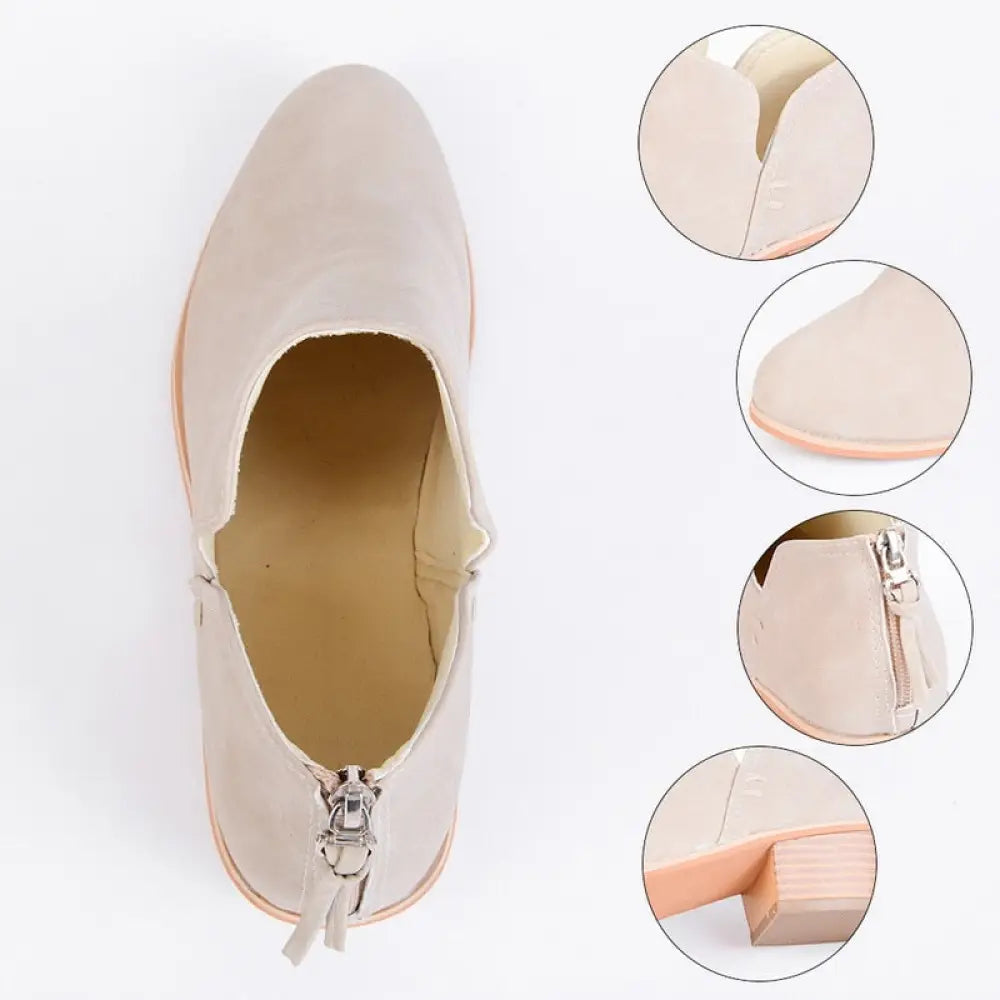 Beige retro suede ankle boot with a low block heel and zipper closure for stylish comfort and easy wear