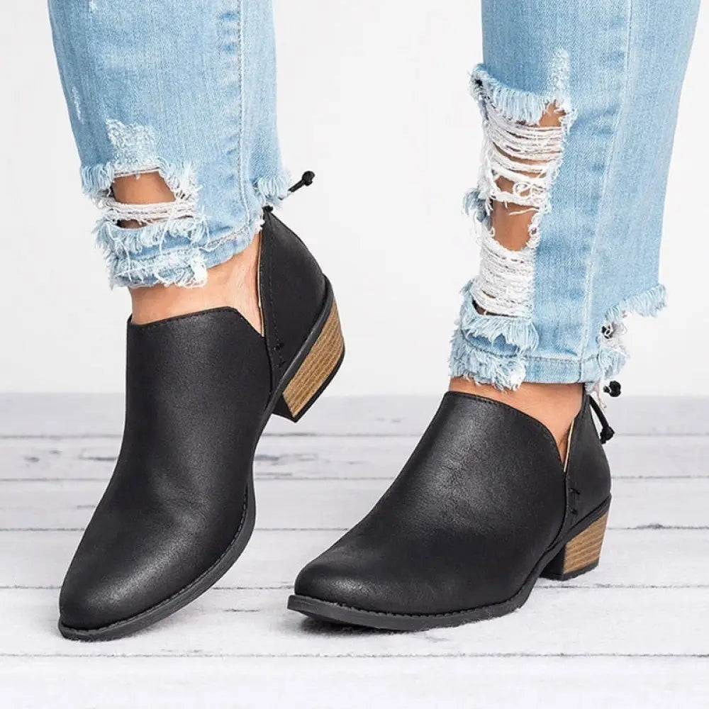 Black leather ankle boots with low block heel and side zipper closure from retro suede collection