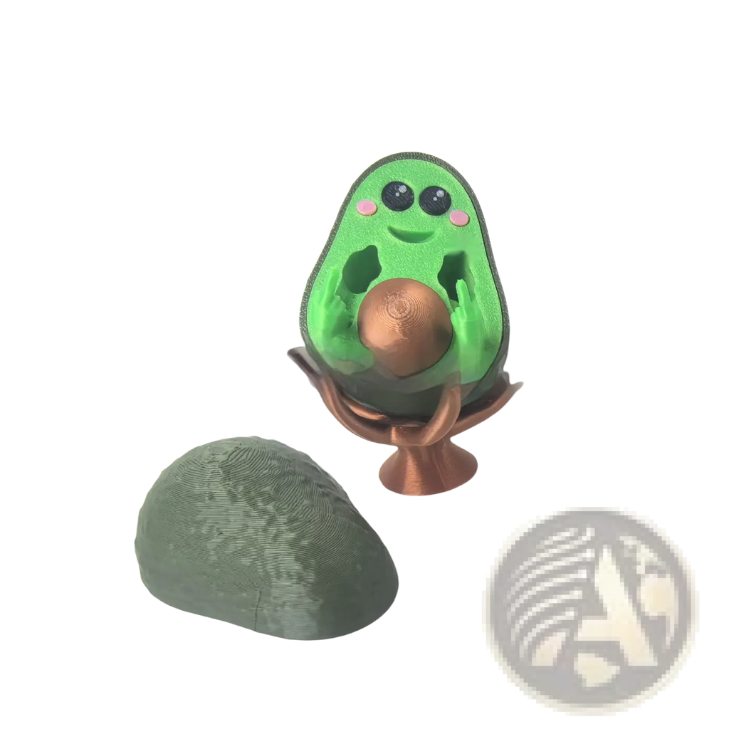 Green avocado-shaped 3d printed desk toy phone stand with black eyes pink cheeks smiling face holding copper sphere