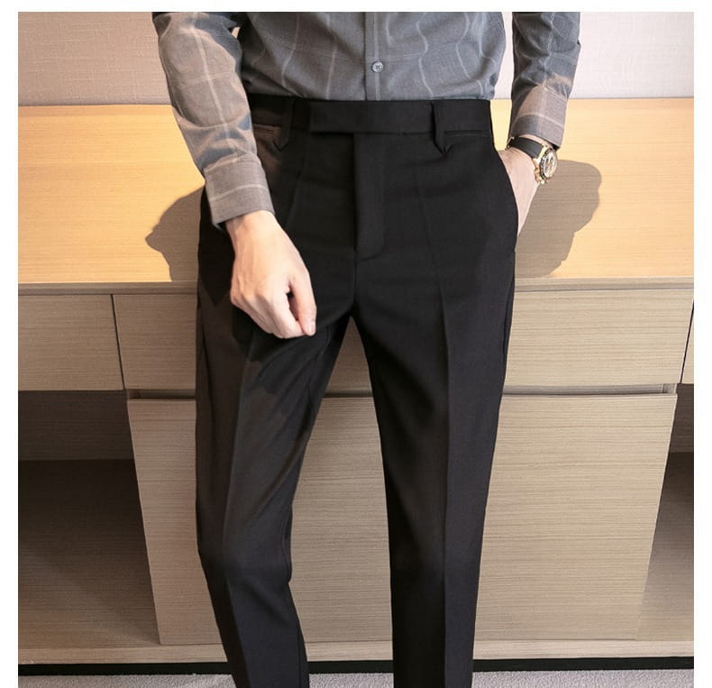 Men’s slim fit British style black tailored trousers with a sleek modern cut and subtle front pleats.