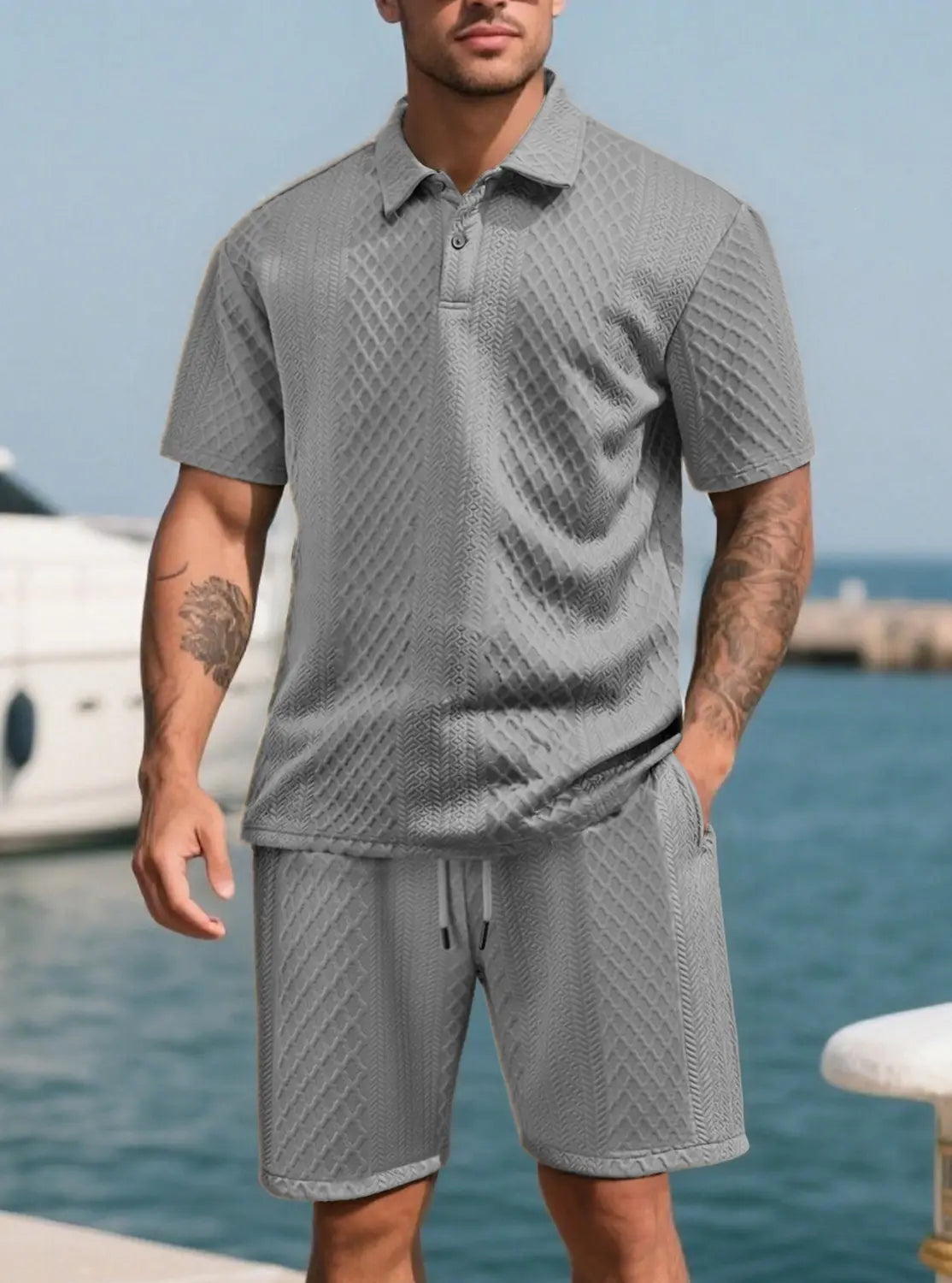 Men textured short sleeve polo suit featuring a gray textured knit polo shirt with matching shorts set.