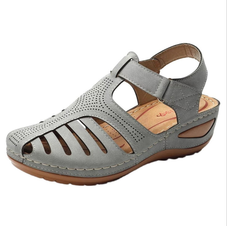 Retro wedge sandals women’s plus size t-strap shoes featuring gray perforated leather with a tan insole and brown sole.