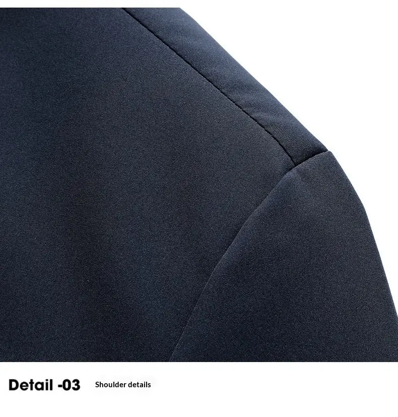 Dark navy blue fabric shoulder with clean structured seam detailing on a men casual business stand collar jacket.