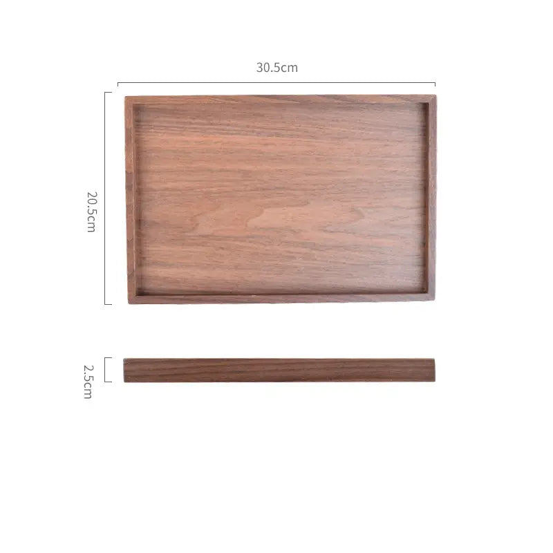 Acacia wood rectangular serving tray with a smooth natural wood grain finish and rounded edges hand polished for serving.