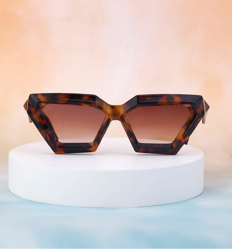modern irregular cat eye uv400 geometric sunglasses featuring tortoiseshell-patterned frames and gradient brown lenses.