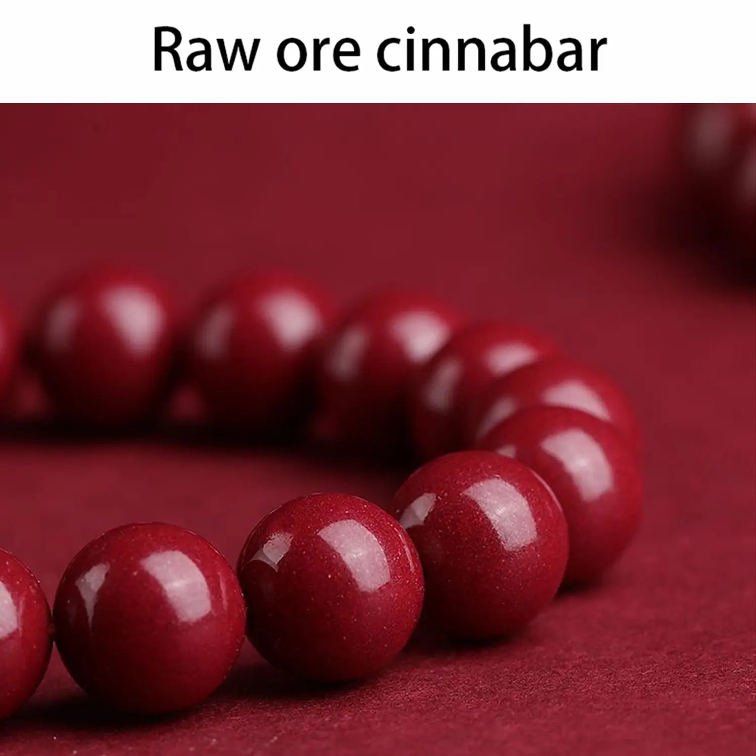 A polished red cinnabar spherical bead bracelet featuring a string of glossy deep red beads made from raw cinnabar ore.