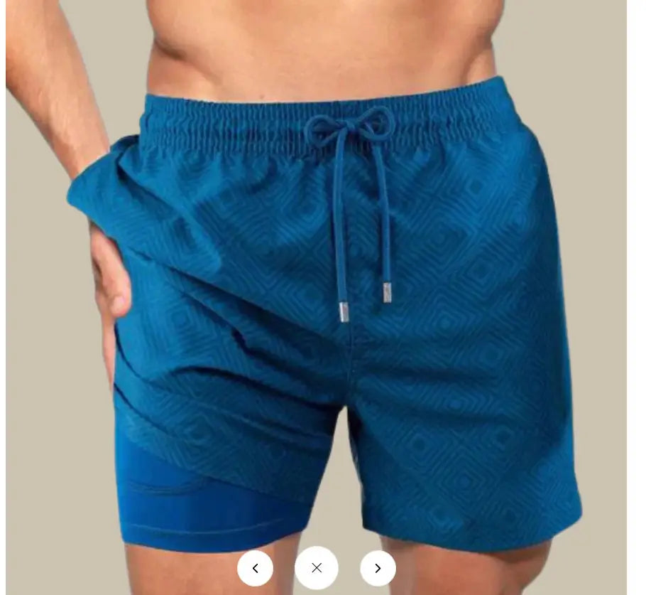 Men’s geometric print double layer beach shorts in vibrant blue featuring a subtle geometric pattern and elastic waistband with matching drawstrings.