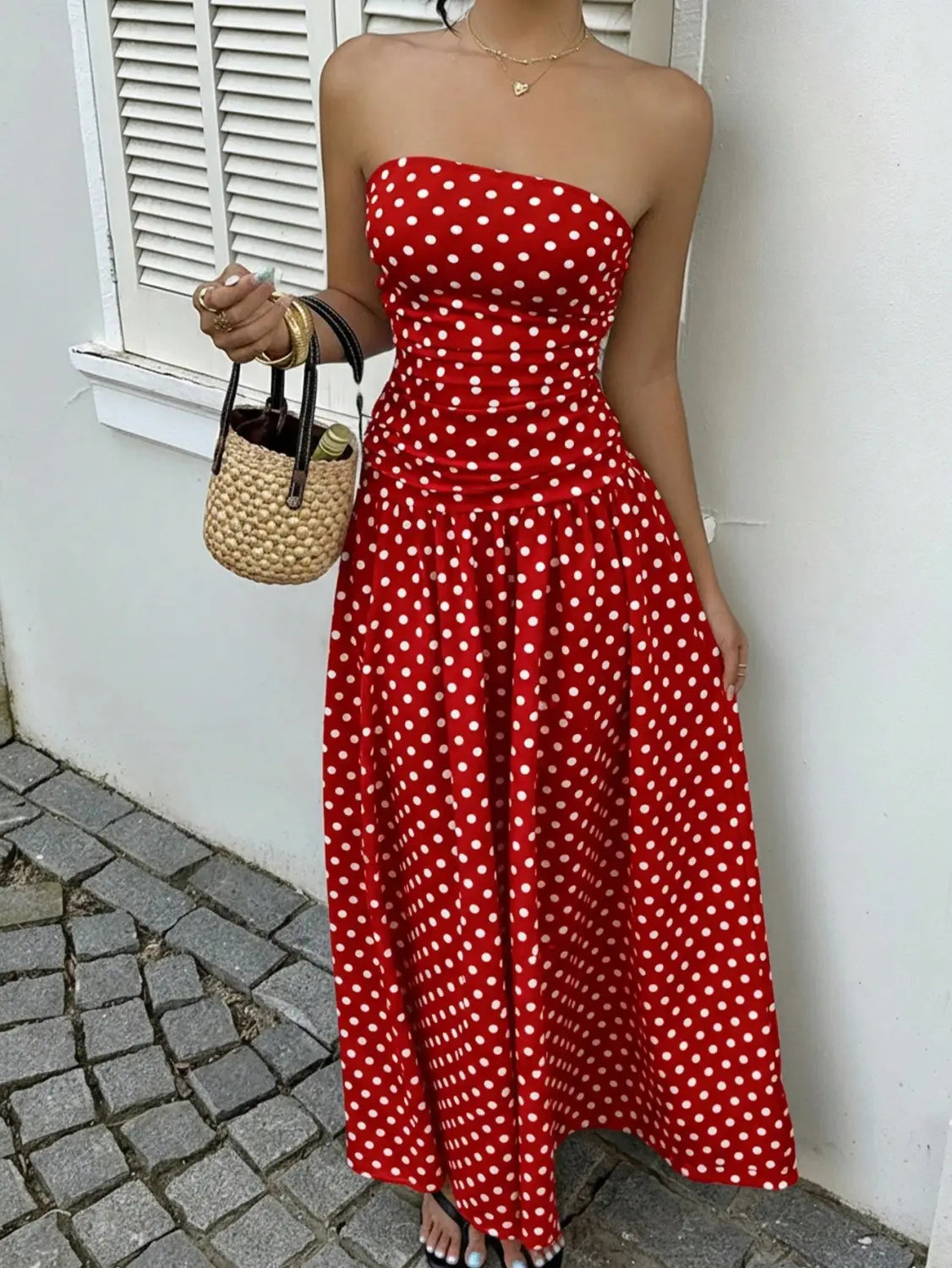 red strapless midi dress with white polka dots featuring an off shoulder design suitable for elegant occasions