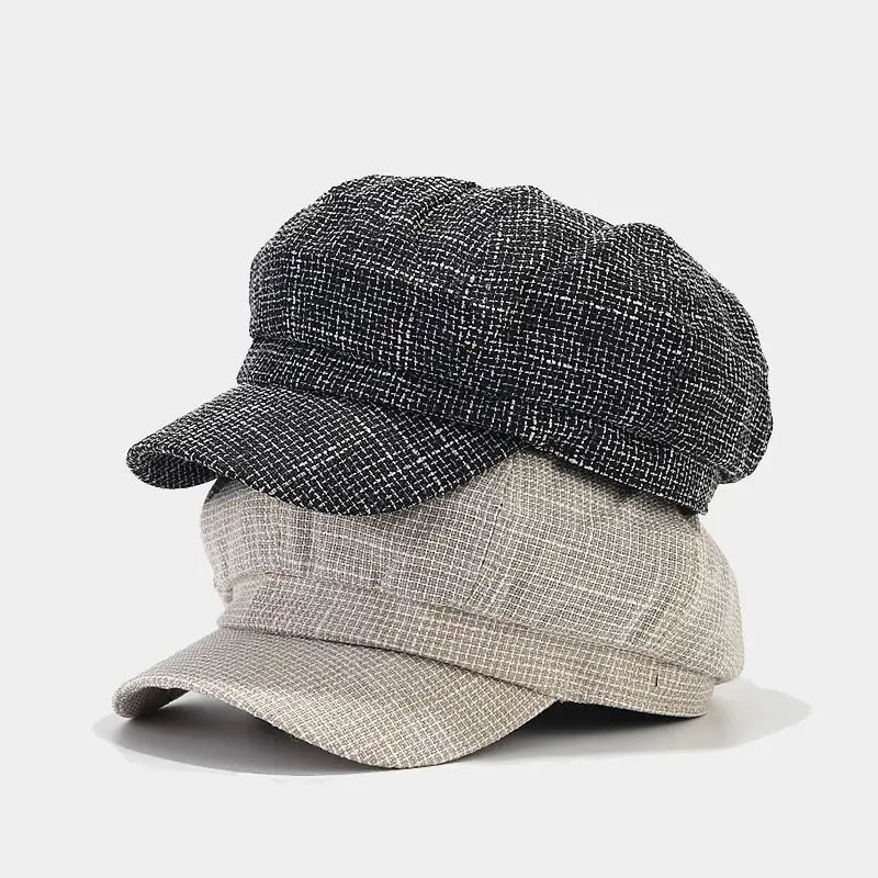 British style tweed octagonal cap for women featuring black and beige colors with a woven fabric finish and textured newsboy design.